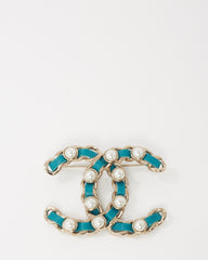 Chanel Silver Metal and Turquoise Blue Leather and Pearl Interwoven CC Logo Brooch